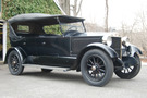 The 1922 Stanley Model 740 has an all black body, wheels, wheel spokes, and top. 
