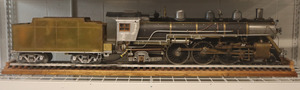 This Pacific Locomotive was created in the 1990's by Charles C. Taccone. It is grey, silver, has gold detailing, and has copper looking wheels